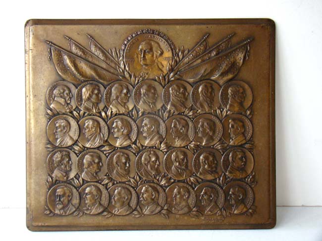 A rare bronze plaque circa 1923 depicting the busts of all the Presidents from George Washinton to Calvin Coolidge